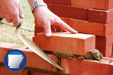 a bricklayer laying brick, building a brick wall - with Arkansas icon