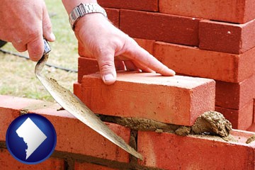 a bricklayer laying brick, building a brick wall - with Washington, DC icon