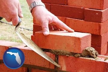 a bricklayer laying brick, building a brick wall - with Florida icon