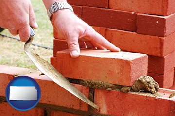 a bricklayer laying brick, building a brick wall - with Kansas icon