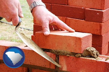 a bricklayer laying brick, building a brick wall - with South Carolina icon